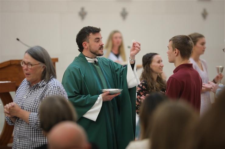 Fr. Ross giving communion